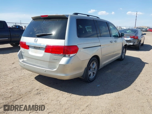 2008 Honda Odyssey Touring with VIN 5FNRL38918B059770, listed as a IAAI auction lot 41920865 with 231,599 mi miles. Bid and sale history available at carsss.com. Image 4.
