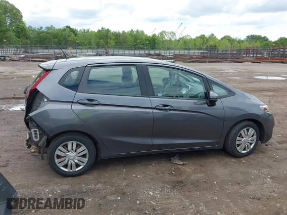 2015 Honda Fit LX z VIN 3HGGK5H59FM714352, wystawiony jako IAAI lot #42156097 z przebiegiem 103 587 mil mil oraz . Historia ofert i sprzedaży dostępna na DreamBid. Obrazek 13.