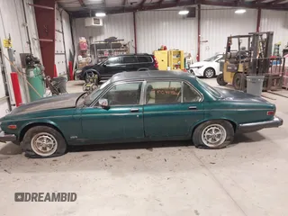 1985 Jaguar XJ with VIN SAJAV1347FC414864, listed as a IAAI auction lot 42118511 with 117,185 mi miles and . Bid and sale history available at DreamBid. Image 14.