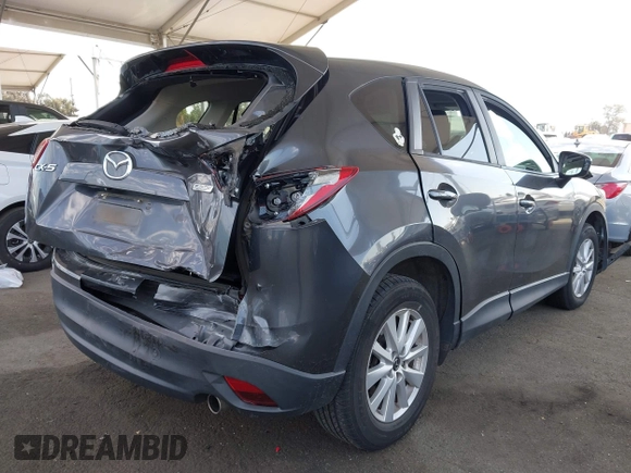 2014 Mazda CX-5 Touring with VIN JM3KE2CY9E0384401, listed as a IAAI auction lot 41699913 with 75,301 mi miles. Bid and sale history available at carsss.com. Image 4.