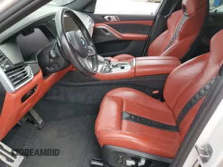2022 BMW X6 M with VIN 5YMCY0C09N9J70336, listed as a Copart auction lot 52682365 with 0 mi miles and Salvage Title. Bid and sale history available at carsss.com. Image 7.