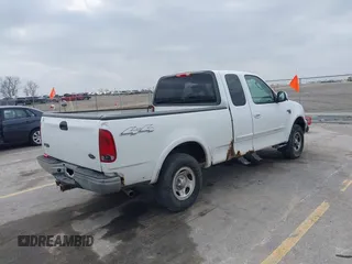 2003 Ford F-150 XL with VIN 1FTRX18L73NB72735, listed as a IAAI auction lot 42016567 with 0 mi miles. Bid and sale history available at carsss.com. Image 4.
