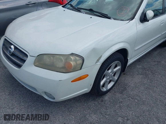 2003 Nissan Maxima SE z VIN JN1DA31DX3T501453, wystawiony jako IAAI lot #42116346 z przebiegiem 127 364 mil mil oraz . Historia ofert i sprzedaży dostępna na DreamBid. Obrazek 6.