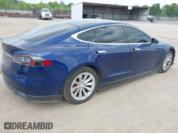 2016 Tesla Model S 90D with VIN 5YJSA1E4XGF168165, listed as a IAAI auction lot 42220139 with Not provided miles and . Bid and sale history available at DreamBid. Image 4.