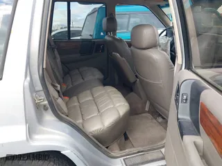 1995 Jeep Grand Cherokee Limited with VIN 1J4GZ78Y3SC649231, listed as a IAAI auction lot 41763953 with 140,889 mi miles. Bid and sale history available at carsss.com. Image 8.