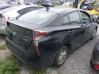 2016 Toyota Prius Two with VIN JTDKBRFU5G3009450, listed as a IAAI auction lot 41945872 with 100,549 mi miles. Bid and sale history available at carsss.com. Image 4.