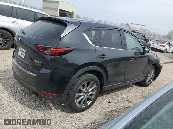2021 Mazda CX-5 Grand Touring with VIN JM3KFBDM6M0401517, listed as a Copart auction lot 51019645 with 55,906 mi miles and Salvage Title. Bid and sale history available at DreamBid. Image 3.