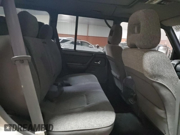 1995 Mitsubishi Montero z VIN 2BGF0126264046653, wystawiony jako Copart lot #81135584 z przebiegiem 254 106 mil mil oraz Czysty tytuł • Clean title. Historia ofert i sprzedaży dostępna na DreamBid. Obrazek 11.