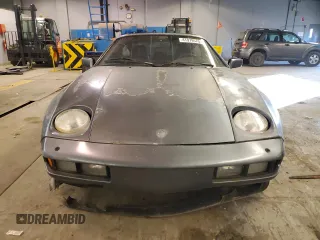 1984 Porsche 928 z VIN WP0JB0925ES861303, wystawiony jako Copart lot #41979575 z przebiegiem 114 593 mil mil oraz Nie do naprawy. Historia ofert i sprzedaży dostępna na DreamBid. Obrazek 5.