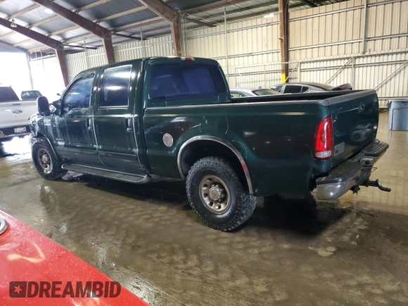 2002 Ford F-250 XL with VIN 1FTNW20F52EA52699, listed as a Copart auction lot 84088814 with 299,869 mi miles and Salvage Title. Bid and sale history available at DreamBid. Image 2.