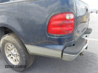 2003 Ford F-150 XLT with VIN 1FTRW076X3KC61967, listed as a IAAI auction lot 42016065 with 206,256 mi miles. Bid and sale history available at carsss.com. Image 14.