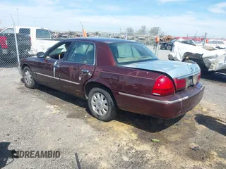 2003 Mercury Grand Marquis LS Premium z VIN 2MEFM75W73X650193, wystawiony jako IAAI lot #41803310 z przebiegiem 151 719 mil mil oraz . Historia ofert i sprzedaży dostępna na DreamBid. Obrazek 3.