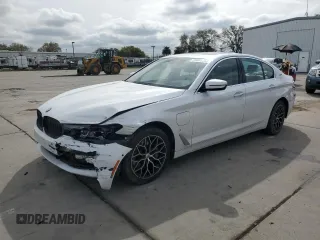 2018 BMW 5 Series 530e xDrive with VIN WBAJB1C58JB084907, listed as a Copart auction lot 49901795 with 109,617 mi miles and Salvage title. Bid and sale history available at DreamBid. Image 1.