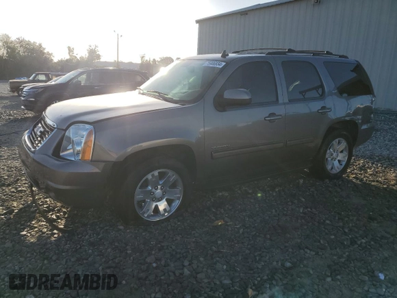 2011 GMC Yukon SLT with VIN 1GKS1CE05BR270876, listed as a Copart auction lot 75906934 with 215,964 mi miles and Salvage Title. Bid and sale history available at carsss.com. Image 1.