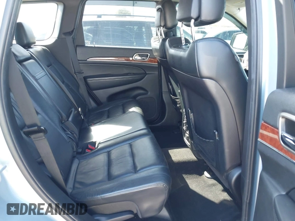 2012 Jeep Grand Cherokee Limited z VIN 1C4RJFBTXCC341813, wystawiony jako IAAI lot #41791662 z przebiegiem 120 811 mil mil oraz . Historia ofert i sprzedaży dostępna na DreamBid. Obrazek 8.
