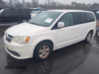 2012 Dodge Grand Caravan SXT with VIN 2C4RDGCG4CR304472, listed as a IAAI auction lot 41396437 with 180,309 mi miles and . Bid and sale history available at DreamBid. Image 2.