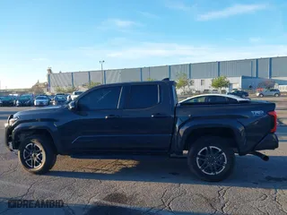 2024 Toyota Tacoma 4WD SR5 with VIN 3TMLB5JN3RM046513, listed as a IAAI auction lot 41231528 with 7,091 mi miles. Bid and sale history available at carsss.com. Image 14.