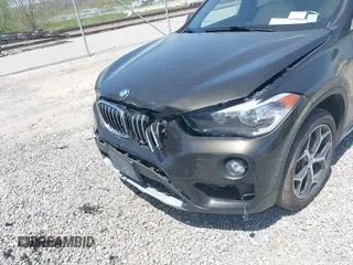 2018 BMW X1 xDrive28i with VIN WBXHT3C39J5F88234, listed as a IAAI auction lot 42044900 with 38,732 mi miles. Bid and sale history available at carsss.com. Image 6.