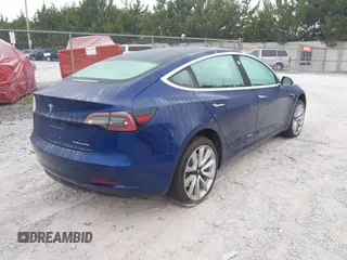 2018 Tesla Model 3 Long Range Battery z VIN 5YJ3E1EBXJF088444, wystawiony jako IAAI lot #42072860 z przebiegiem 46 063 mil mil oraz . Historia ofert i sprzedaży dostępna na DreamBid. Obrazek 4.