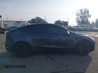 2023 Tesla Model Y Long Range with VIN 7SAYGDEE7PA196038, listed as a IAAI auction lot 41459601 with 16,489 mi miles and . Bid and sale history available at DreamBid. Image 13.