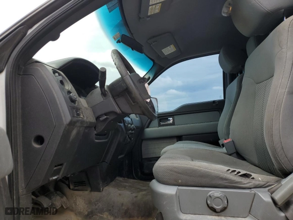 2014 Ford F-150 XL with VIN 1FTNF1CT3EKE02302, listed as a Copart auction lot 69056354 with 203,763 mi miles and Salvage Title. Bid and sale history available at carsss.com. Image 7.