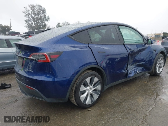 2022 Tesla Model Y Long Range with VIN 7SAYGDEE8NF511395, listed as a IAAI auction lot 41595310 with 65,156 mi miles and . Bid and sale history available at DreamBid. Image 4.