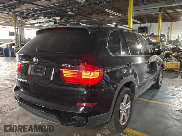 2011 BMW X5 35d with VIN 5UXZW0C55BL661651, listed as a Copart auction lot 61866905 with 162,927 mi miles and Clean title. Bid and sale history available at DreamBid. Image 4.