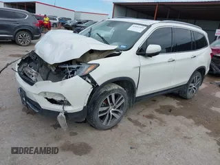 2017 Honda Pilot Touring with VIN 5FNYF6H9XHB034001, listed as a IAAI auction lot 42092549 with 142,422 mi miles and . Bid and sale history available at DreamBid. Image 17.