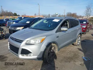 2014 Ford Escape Titanium with VIN 1FMCU0JX3EUB22005, listed as a IAAI auction lot 41610799 with 248,066 mi miles. Bid and sale history available at carsss.com. Image 2.