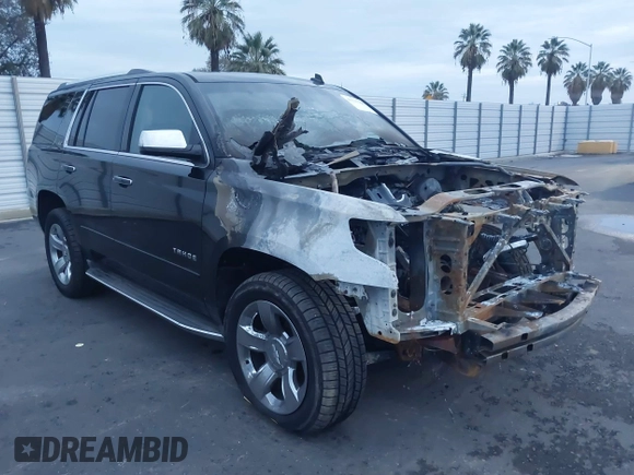 2015 Chevrolet Tahoe LTZ z VIN 1GNSKCKC5FR213209, wystawiony jako IAAI lot #41023368 z przebiegiem Nie podano mil oraz . Historia ofert i sprzedaży dostępna na DreamBid. Obrazek 1.