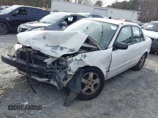 2000 Mazda Protege DX with VIN JM1BJ2221Y0208156, listed as a IAAI auction lot 41609657 with 435,304 mi miles and . Bid and sale history available at DreamBid. Image 2.