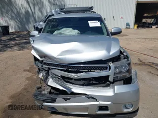 2013 Chevrolet Suburban LT with VIN 1GNSCJE06DR138925, listed as a IAAI auction lot 42008011 with 236,244 mi miles. Bid and sale history available at carsss.com. Image 12.
