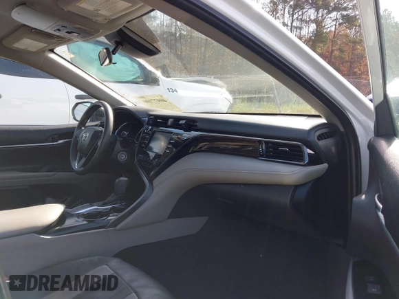 2020 Toyota Camry LE with VIN 4T1C11AKXLU986310, listed as a IAAI auction lot 40977100 with 108,208 mi miles and . Bid and sale history available at DreamBid. Image 5.