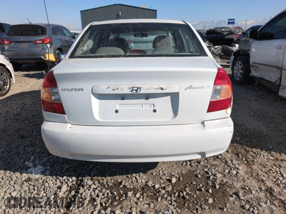 2000 Hyundai Accent z VIN KMHCG45G0YU084004, wystawiony jako Copart lot #42980585 z przebiegiem 167 545 mil mil oraz Czysty tytuł • Clean title. Historia ofert i sprzedaży dostępna na DreamBid. Obrazek 6.