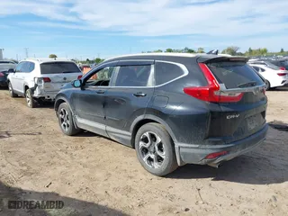 2017 Honda CR-V Touring with VIN 5J6RW2H96HL037854, listed as a IAAI auction lot 40472748 with 126,582 mi miles. Bid and sale history available at carsss.com. Image 3.