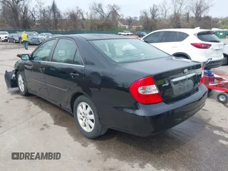 2004 Toyota Camry LE with VIN 4T1BF30K34U080477, listed as a IAAI auction lot 41956998 with 135,441 mi miles. Bid and sale history available at carsss.com. Image 3.