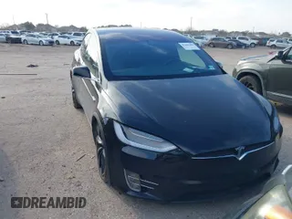 2019 Tesla Model X 75D with VIN 5YJXCBE21KF180203, listed as a IAAI auction lot 41606200 with 114,294 mi miles. Bid and sale history available at carsss.com. Image 1.