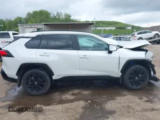 2024 Toyota RAV4 Hybrid SE with VIN 2T3T6RFV3RW066117, listed as a IAAI auction lot 42198742 with 12,352 mi miles and . Bid and sale history available at DreamBid. Image 14.