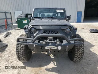 2016 Jeep Wrangler Unlimited Rubicon with VIN 1C4BJWFG8GL192077, listed as a Copart auction lot 58339005 with 62,076 mi miles and Salvage title. Bid and sale history available at DreamBid. Image 5.