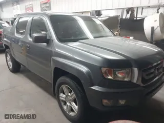 2011 Honda Ridgeline RTL with VIN 5FPYK1F57BB004189, listed as a IAAI auction lot 41871741 with 193,913 mi miles. Bid and sale history available at carsss.com. Image 1.