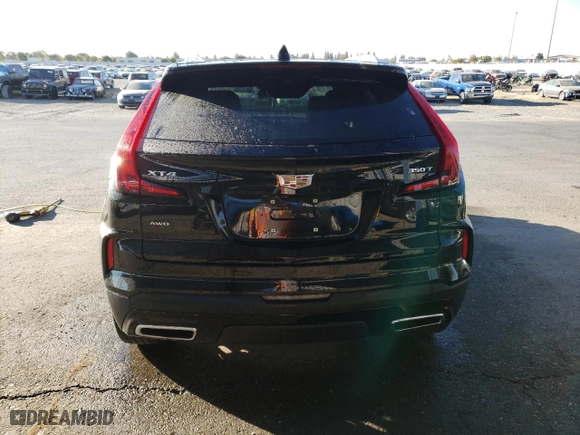 2024 Cadillac XT4 AWD Premium Luxury with VIN 1GYFZDR49RF128402, listed as a Copart auction lot 77630154 with 20,673 mi miles and Salvage Title. Bid and sale history available at carsss.com. Image 6.