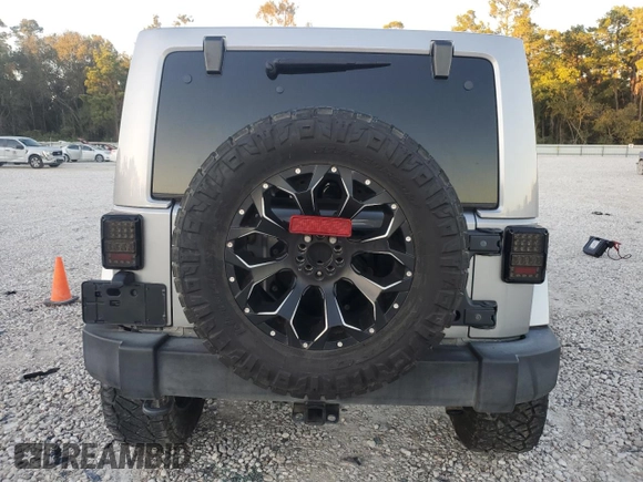 2017 Jeep Wrangler Unlimited Sahara with VIN 1C4HJWEG8HL697341, listed as a Copart auction lot 81313424 with 118,693 mi miles and Salvage title. Bid and sale history available at DreamBid. Image 6.