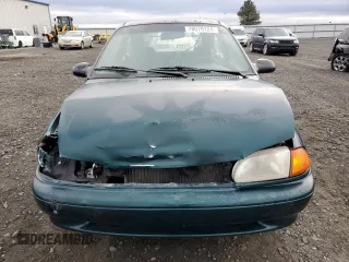 1995 Ford Aspire z VIN KNJLT05H6S6157368, wystawiony jako Copart lot #78079124 z przebiegiem 130 014 mil mil oraz Szkody całkowita. Historia ofert i sprzedaży dostępna na DreamBid. Obrazek 5.