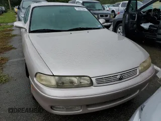 1993 Mazda 626 z VIN 1YVGE22B9P5208685, wystawiony jako Copart lot #73931064 z przebiegiem 91 446 mil mil oraz Nie do naprawy. Historia ofert i sprzedaży dostępna na DreamBid. Obrazek 5.