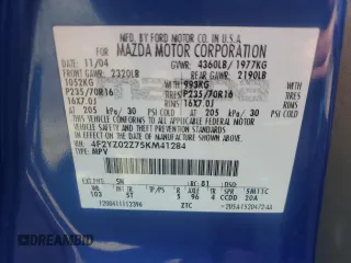 2005 Mazda Tribute i with VIN 4F2YZ02Z75KM41284, listed as a Copart auction lot 79907184 with 230,523 mi miles and Salvage Title. Bid and sale history available at carsss.com. Image 13.