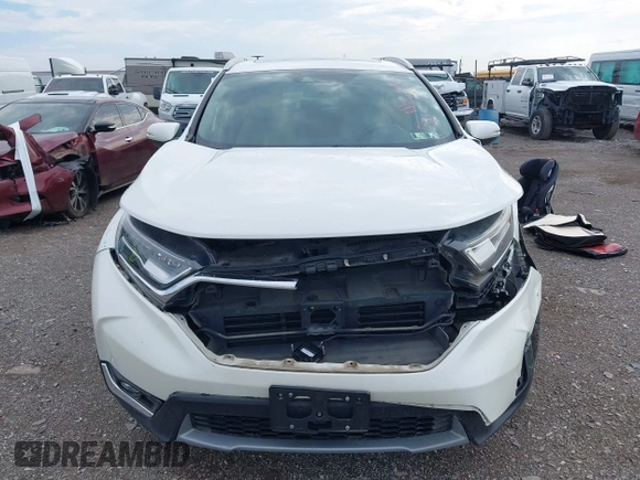 2018 Honda CR-V Touring with VIN 2HKRW2H91JH665241, listed as a IAAI auction lot 42638694 with 62,066 mi miles and . Bid and sale history available at DreamBid. Image 12.