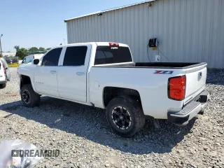 2016 Chevrolet Silverado 1500 LT with VIN 3GCUKREC9GG185402, listed as a Copart auction lot 52292115 with 131,861 mi miles and Salvage Title. Bid and sale history available at DreamBid. Image 2.