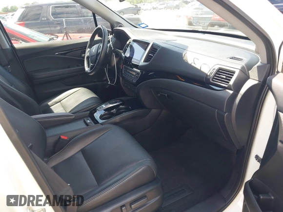2017 Honda Pilot Touring with VIN 5FNYF6H92HB054145, listed as a IAAI auction lot 42200391 with 70,096 mi miles and . Bid and sale history available at DreamBid. Image 5.