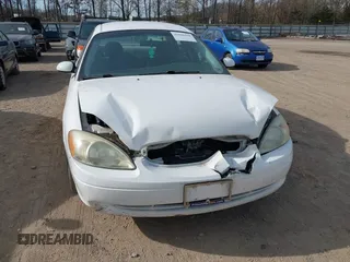 2003 Ford Taurus SE Standard with VIN 1FAFP53U73A107231, listed as a IAAI auction lot 41826418 with 123,774 mi miles. Bid and sale history available at carsss.com. Image 6.