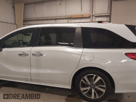 2021 Honda Odyssey Touring with VIN 5FNRL6H80MB026908, listed as a IAAI auction lot 41564765 with 116,453 mi miles. Bid and sale history available at carsss.com. Image 14.